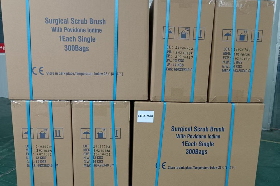 Export cartons of surgical scrub brushes strapped for shipment